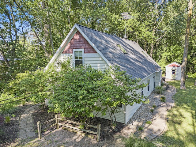 488 Solace Way S, Haven, MI 49090 - view of side of property featuring a shingled roof and a storage shed