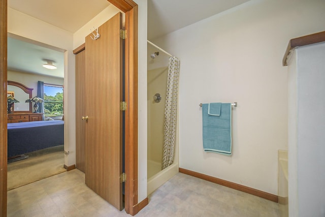 131 E Ave, Jackson, MI 49201 - bathroom with a shower stall and tile patterned floors