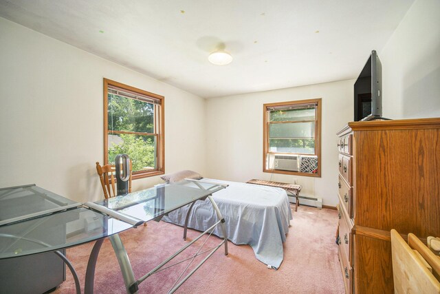 131 E Ave, Jackson, MI 49201 - bedroom with baseboard heating, cooling unit, and light carpet