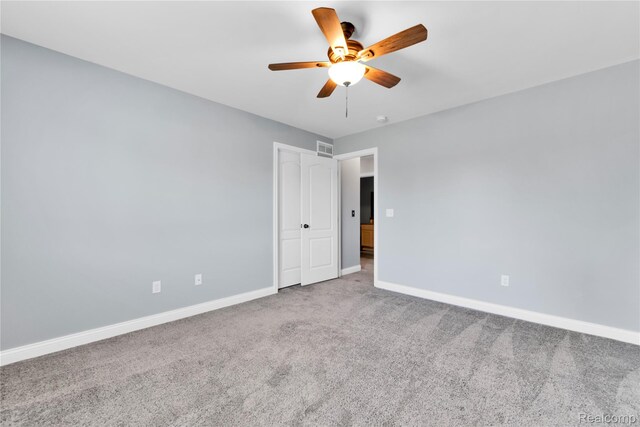 343 Hidden Riv E, Holly, MI 48442 - spare room featuring ceiling fan and carpet floors