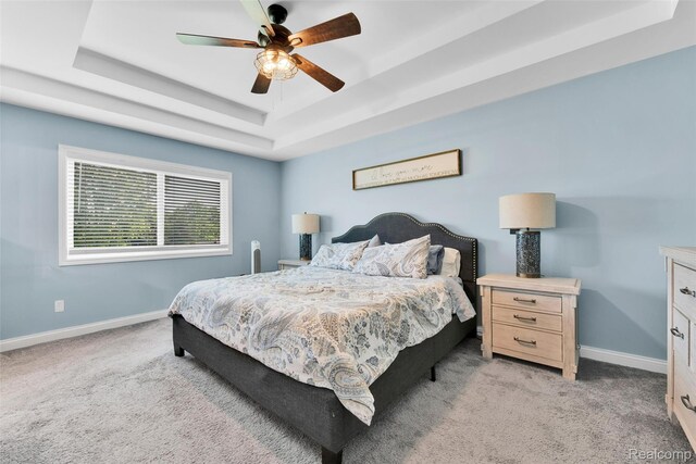 343 Hidden Riv E, Holly, MI 48442 - bedroom with a tray ceiling, light colored carpet, and a ceiling fan