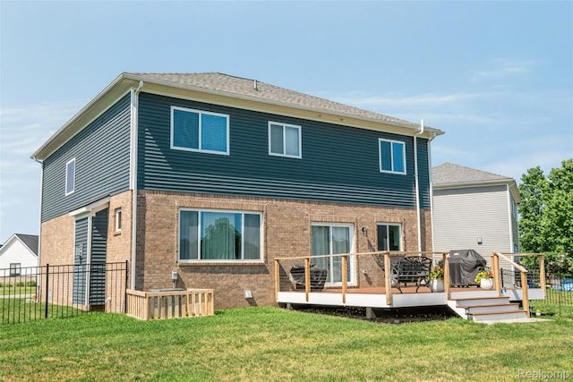 343 Hidden Riv E, Holly, MI 48442 - back of house with a wooden deck and brick siding