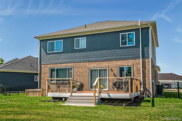 343 Hidden Riv E, Holly, MI 48442 - rear view of house with a wooden deck and brick siding