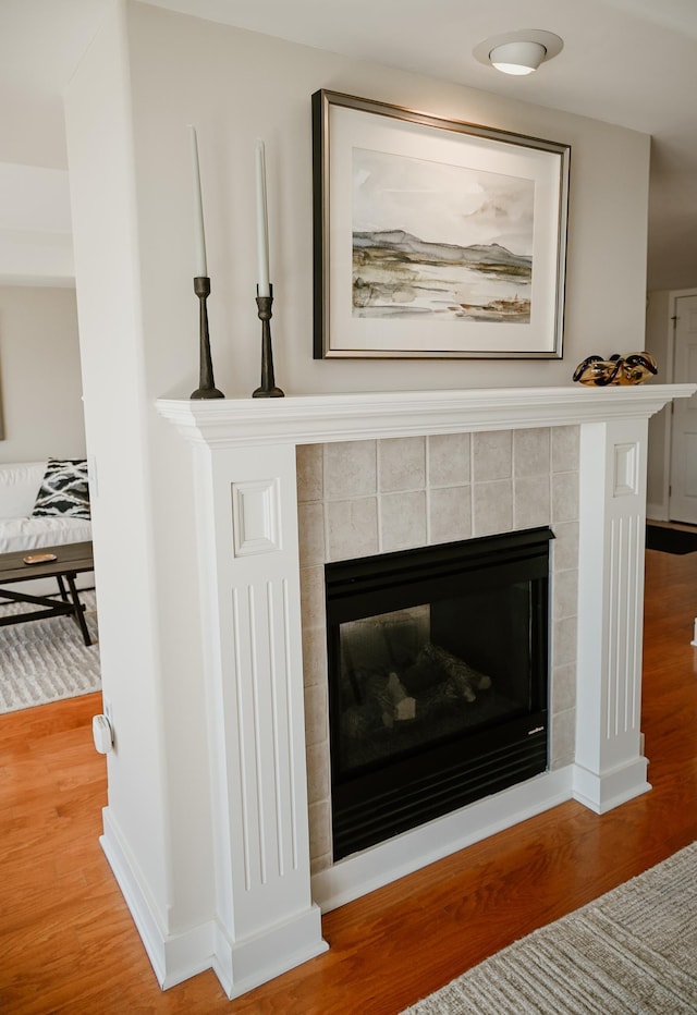 706 N Dockside Cir, Suttons Bay, MI 49682 - detailed view of wood finished floors and a tiled fireplace