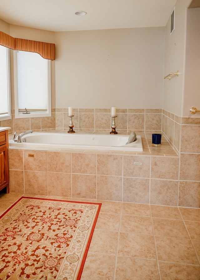706 N Dockside Cir, Suttons Bay, MI 49682 - full bathroom with a garden tub, vanity, and tile patterned flooring