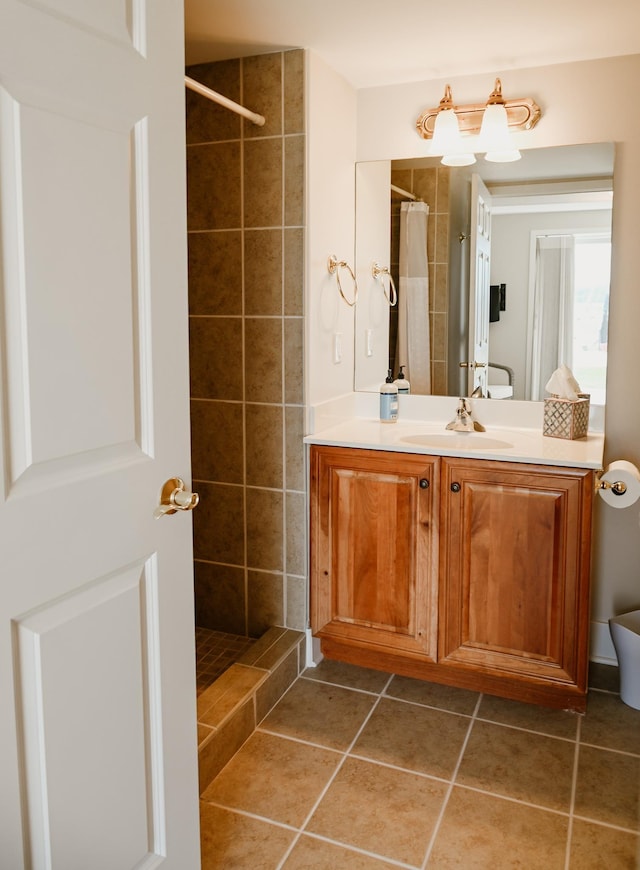 706 N Dockside Cir, Suttons Bay, MI 49682 - bathroom featuring vanity, tiled shower, and tile patterned floors
