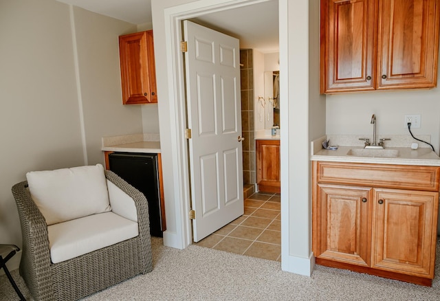 706 N Dockside Cir, Suttons Bay, MI 49682 - sitting room with wet bar, light tile patterned floors, and light carpet