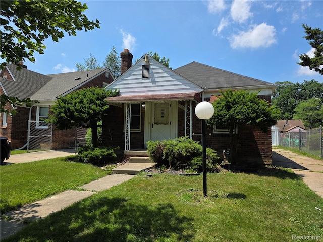 19351 Braile St, Detroit, MI 48219 - bungalow featuring brick siding, a chimney, and a porch