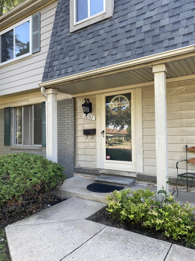 26292 Franklin Pointe Dr, Southfield, MI 48034 - entrance to property featuring roof with shingles and covered porch