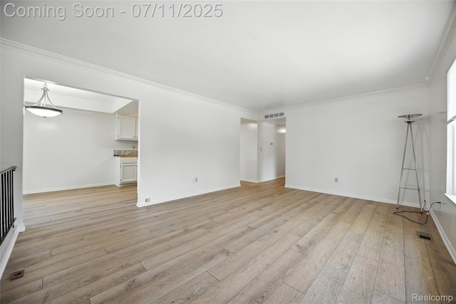276 Meadow Bridge Dr, Rochester Hills, MI 48307 - unfurnished living room with light wood-style flooring and ornamental molding