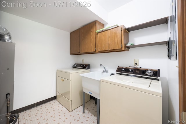 276 Meadow Bridge Dr, Rochester Hills, MI 48307 - laundry area with cabinet space, washing machine and dryer, and light floors