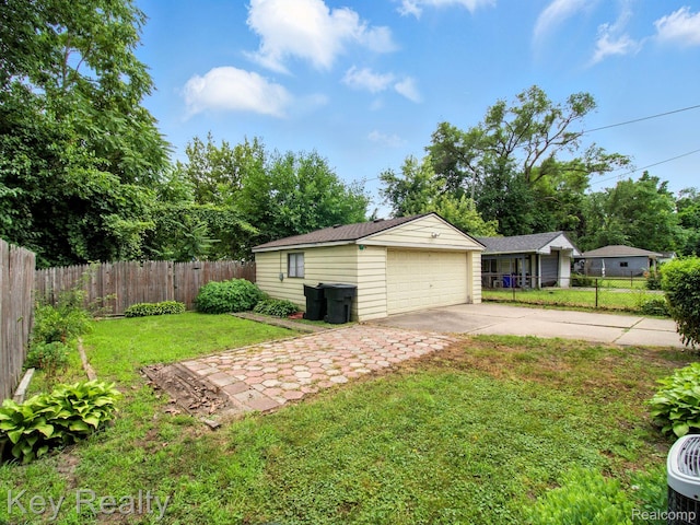 1225 S Annabelle St, Detroit, MI 48217 - view of yard featuring a detached garage and an outbuilding