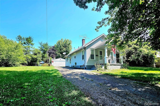 675 E Beverly Ave, Royal Oak, MI 48340 - view of property exterior with a chimney, a porch, and a lawn