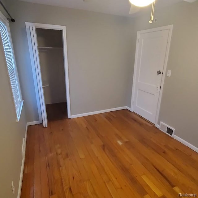 675 E Beverly Ave, Royal Oak, MI 48340 - unfurnished bedroom with light wood finished floors and a closet