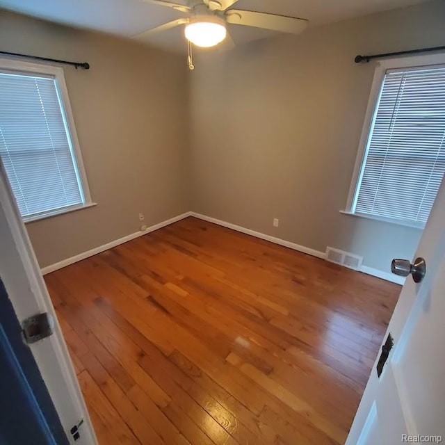 675 E Beverly Ave, Royal Oak, MI 48340 - unfurnished room featuring wood-type flooring and ceiling fan