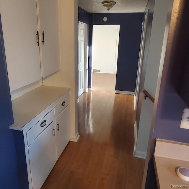 675 E Beverly Ave, Royal Oak, MI 48340 - corridor with wood finished floors and baseboards