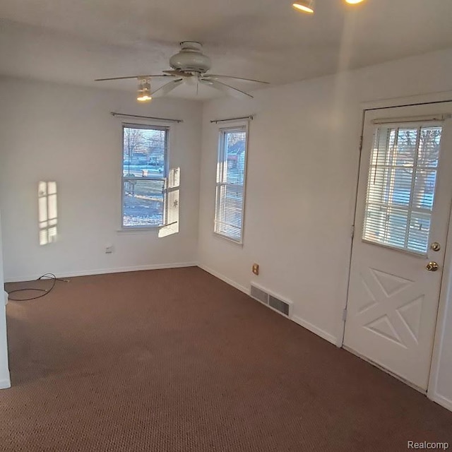 675 E Beverly Ave, Royal Oak, MI 48340 - foyer with a ceiling fan and dark carpet