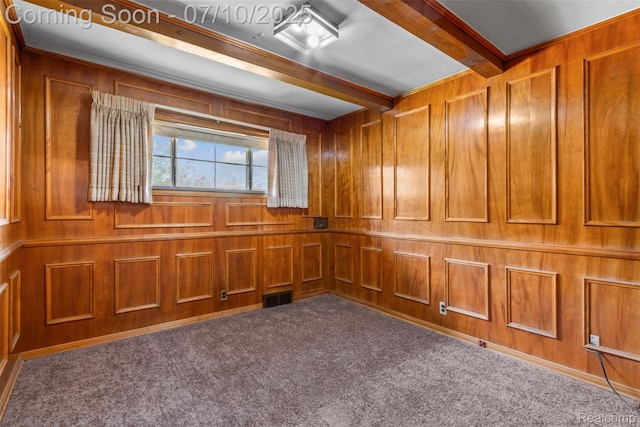 24280 Moritz St, Oak Park, MI 48237 - spare room featuring carpet floors, beam ceiling, wood walls, and a decorative wall
