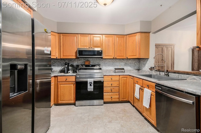 3787 Santa Fe Trl, Ann Arbor, MI 48108 - kitchen featuring appliances with stainless steel finishes, tasteful backsplash, and light countertops