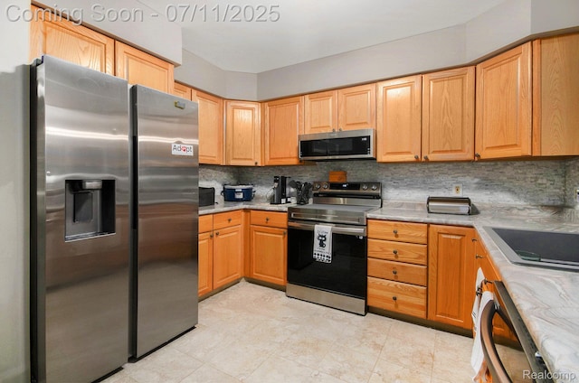 3787 Santa Fe Trl, Ann Arbor, MI 48108 - kitchen with appliances with stainless steel finishes and backsplash