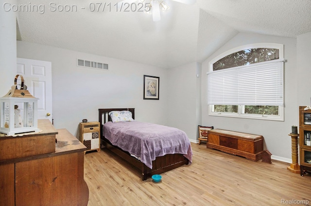 3787 Santa Fe Trl, Ann Arbor, MI 48108 - bedroom featuring light wood-style flooring, lofted ceiling, and a textured ceiling