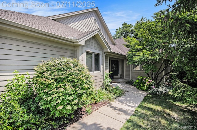 3787 Santa Fe Trl, Ann Arbor, MI 48108 - view of exterior entry with a shingled roof