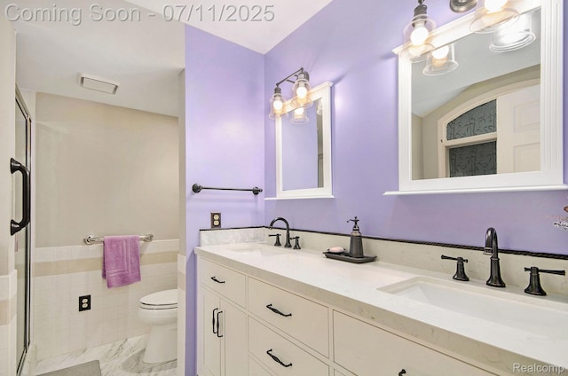 3787 Santa Fe Trl, Ann Arbor, MI 48108 - full bathroom with double vanity, a stall shower, a wainscoted wall, and tile walls