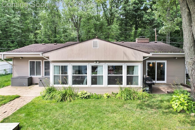 1890 Darwin Rd, Pinckney, MI 48169 - back of house with a patio, a shingled roof, a yard, and a chimney