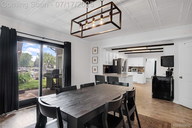 1890 Darwin Rd, Pinckney, MI 48169 - dining room featuring an ornate ceiling, light wood-style floors, and a chandelier