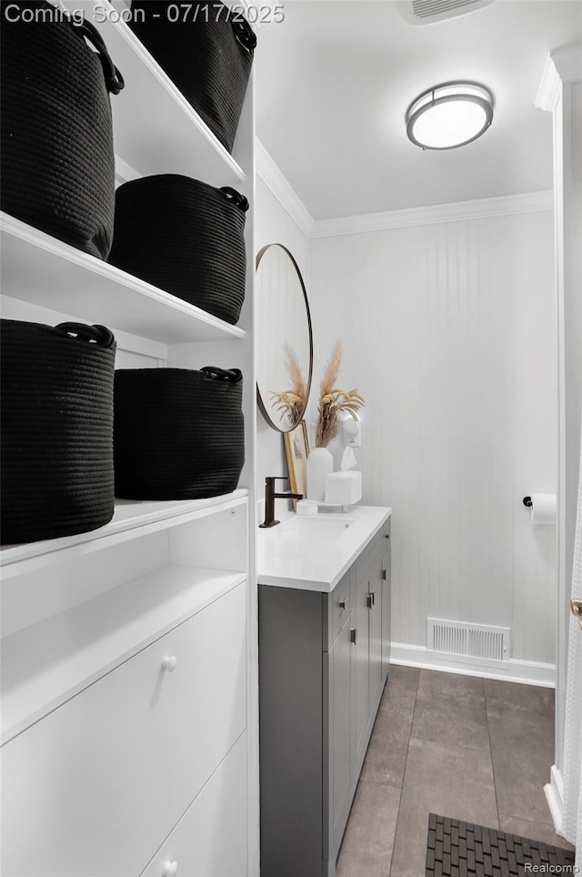 1890 Darwin Rd, Pinckney, MI 48169 - laundry area featuring crown molding and light tile patterned flooring