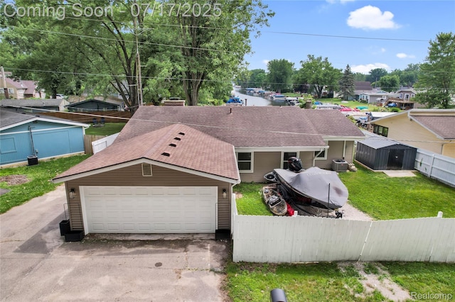 1890 Darwin Rd, Pinckney, MI 48169 - view of front of property featuring roof with shingles and a garage