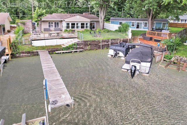 1890 Darwin Rd, Pinckney, MI 48169 - dock featuring a fenced backyard and a wooden deck