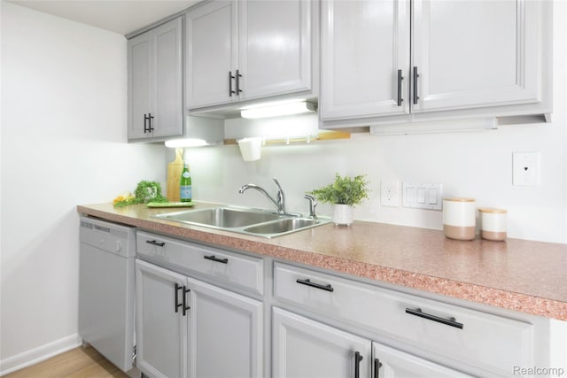 9671 Harbour Cove Ct, Ypsilanti, MI 48197 - kitchen featuring white dishwasher and light countertops