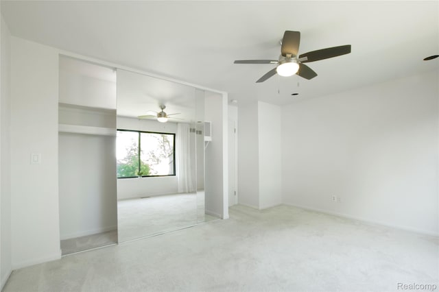 9671 Harbour Cove Ct, Ypsilanti, MI 48197 - unfurnished bedroom with light colored carpet, ceiling fan, and a closet