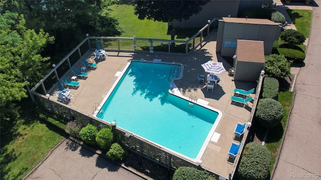 9671 Harbour Cove Ct, Ypsilanti, MI 48197 - community pool featuring a patio