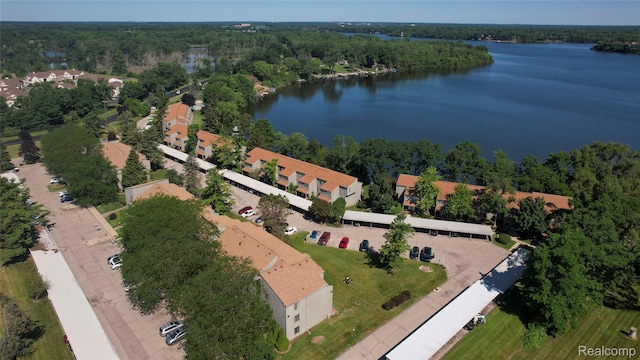 9671 Harbour Cove Ct, Ypsilanti, MI 48197 - aerial view of property and surrounding area featuring a nearby body of water and a heavily wooded area