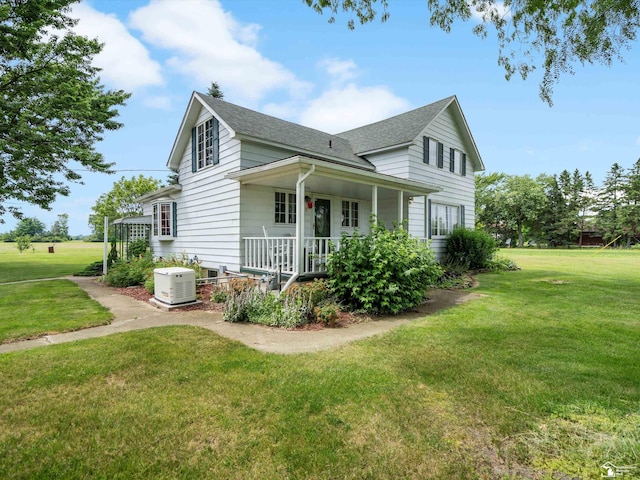 7393 Newport S Rd, Newport, MI 48166 - view of side of home with a porch, a lawn, and roof with shingles