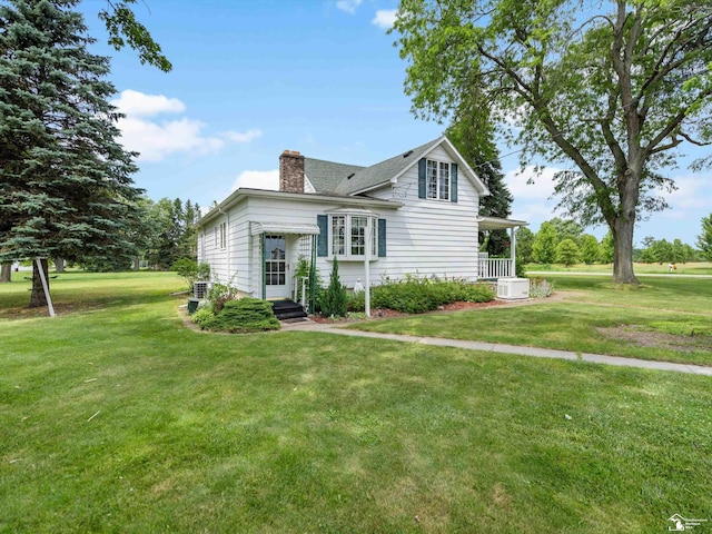 7393 Newport S Rd, Newport, MI 48166 - view of front of property with a chimney and a front lawn