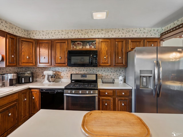 7393 Newport S Rd, Newport, MI 48166 - kitchen with black appliances, light countertops, brown cabinets, and open shelves