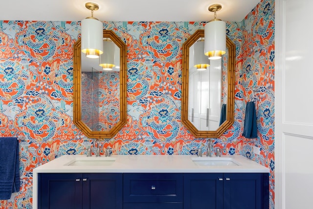 613 E Mitchell St, Petoskey, MI 49770 - full bath with wallpapered walls and double vanity