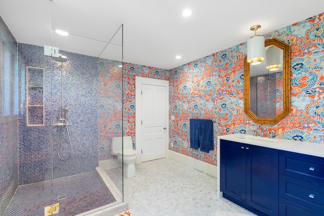 613 E Mitchell St, Petoskey, MI 49770 - bathroom featuring a shower stall, vanity, wallpapered walls, and recessed lighting