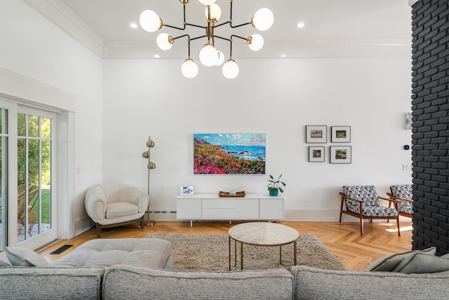 613 E Mitchell St, Petoskey, MI 49770 - living area with a towering ceiling, a chandelier, and a baseboard heating unit