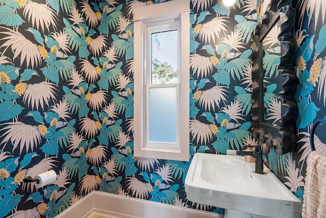 613 E Mitchell St, Petoskey, MI 49770 - bathroom with wallpapered walls and a sink