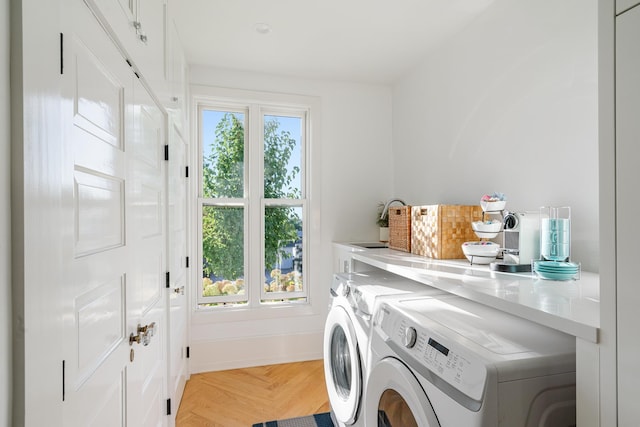 613 E Mitchell St, Petoskey, MI 49770 - laundry room with washer and dryer and baseboards
