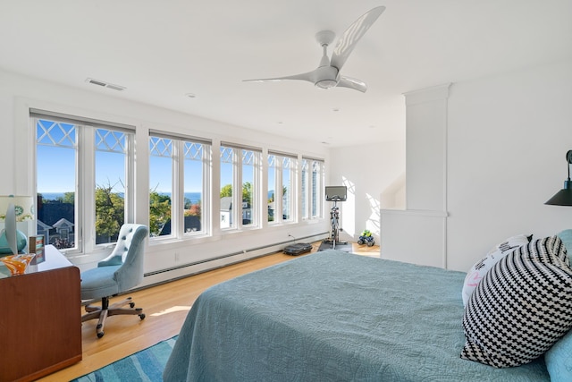 613 E Mitchell St, Petoskey, MI 49770 - bedroom featuring wood finished floors and ceiling fan