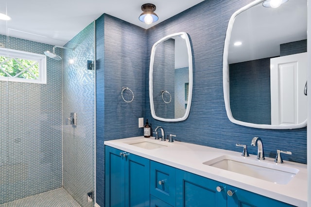 613 E Mitchell St, Petoskey, MI 49770 - bathroom featuring a shower stall and double vanity