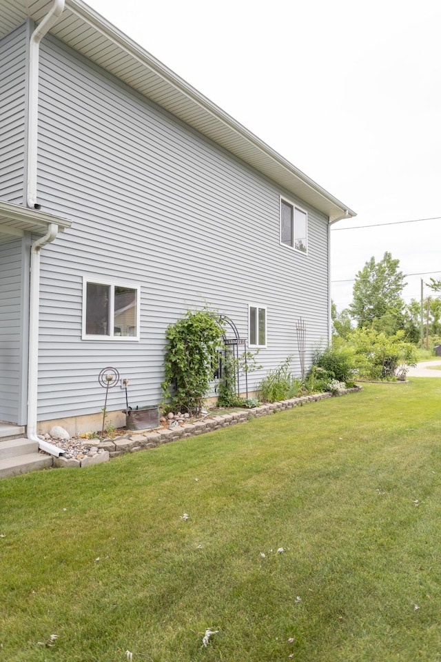 11105 Hahn Beach Dr, Evart, MI 49631 - view of side of home with a yard