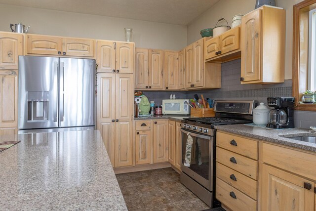 11105 Hahn Beach Dr, Evart, MI 49631 - kitchen featuring appliances with stainless steel finishes and light brown cabinets