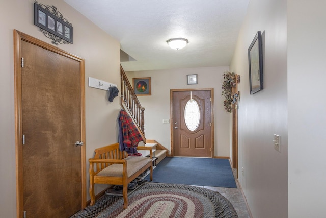 11105 Hahn Beach Dr, Evart, MI 49631 - entrance foyer featuring baseboards and stairs