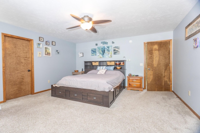 11105 Hahn Beach Dr, Evart, MI 49631 - bedroom with light carpet, ceiling fan, and a textured ceiling